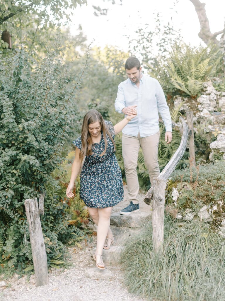 Fine art Switzerland engagement photographer capturing a romantic stroll in Geneva’s botanical garden