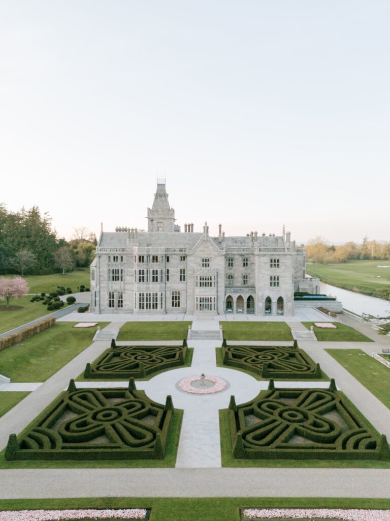 Front view of Adare Manor with manicured grounds