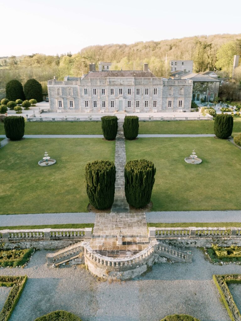 Front facade of Gloster House surrounded by greenery
