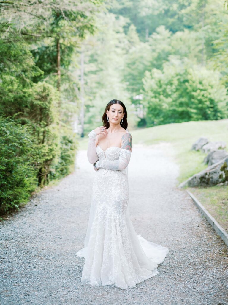 Bride posing elegantly with flowing wedding gown at an elopement in switzerland