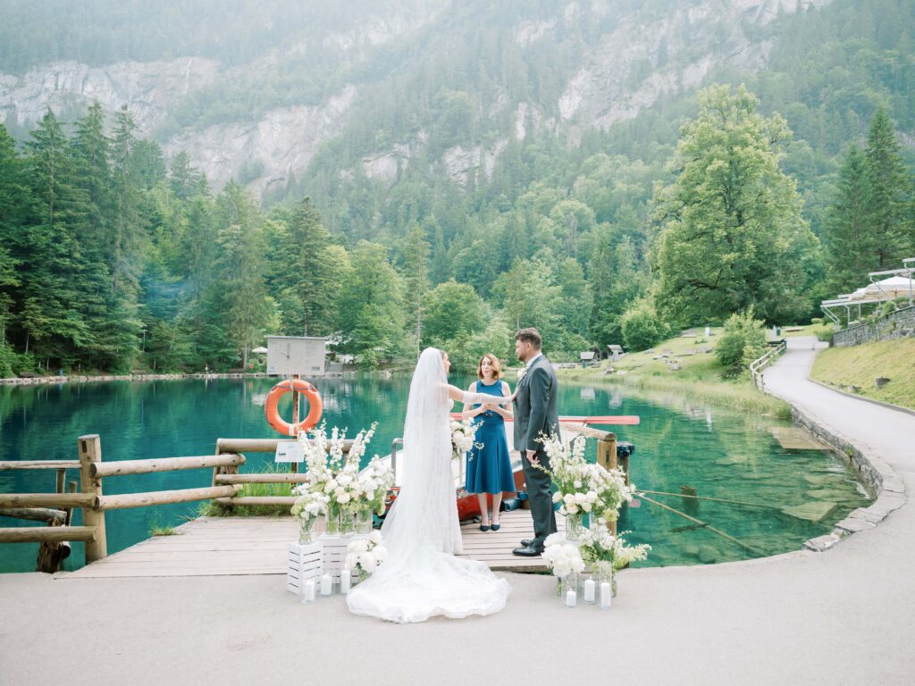 Switzerland elopement photographer capturing a couple at Blausee
