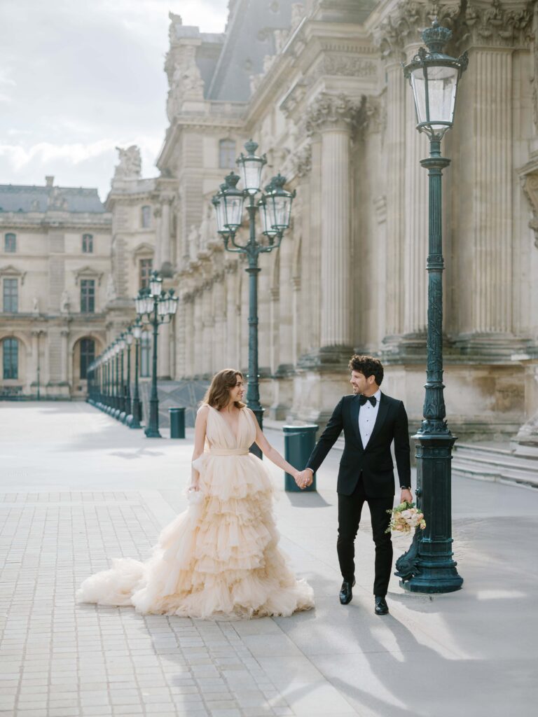 paris wedding photographer fine art couple walking paris streets